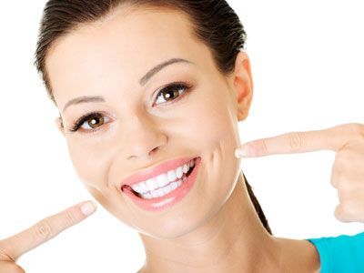 Woman smiling at her teeth