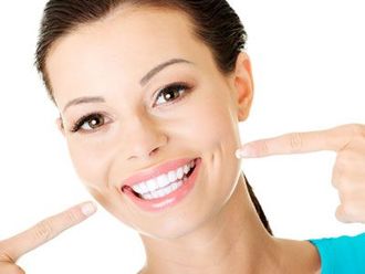 Woman smiling at her teeth