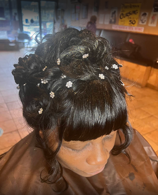 A woman is getting her hair done in a salon.