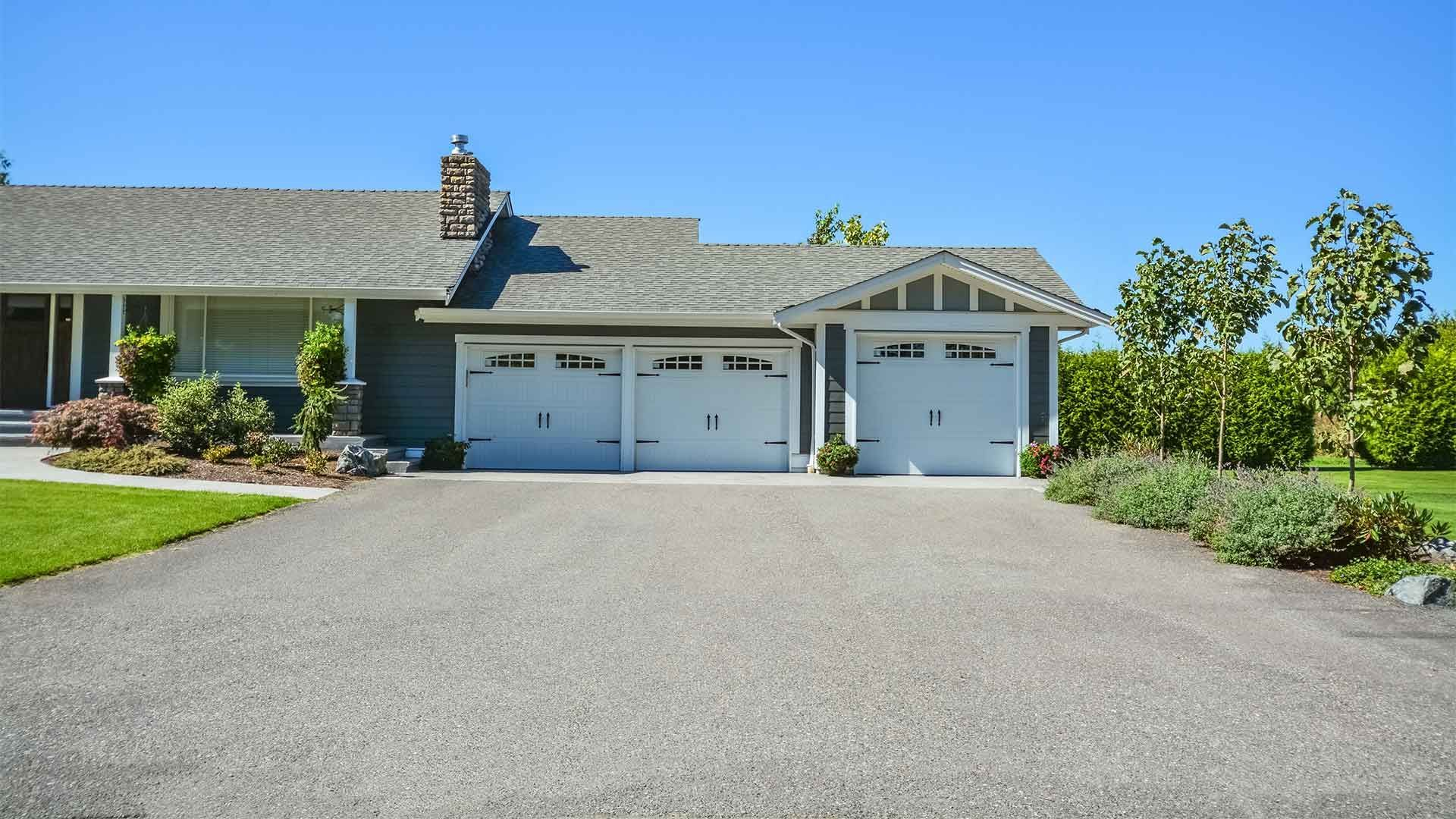A house with two garage doors and a driveway