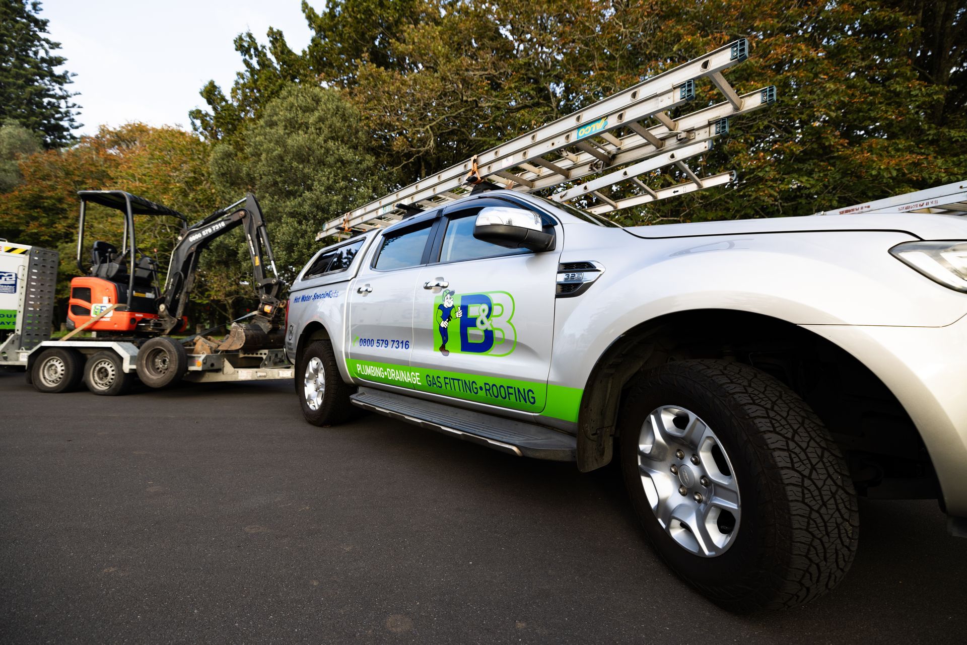Person installing terracotta roof tiles.