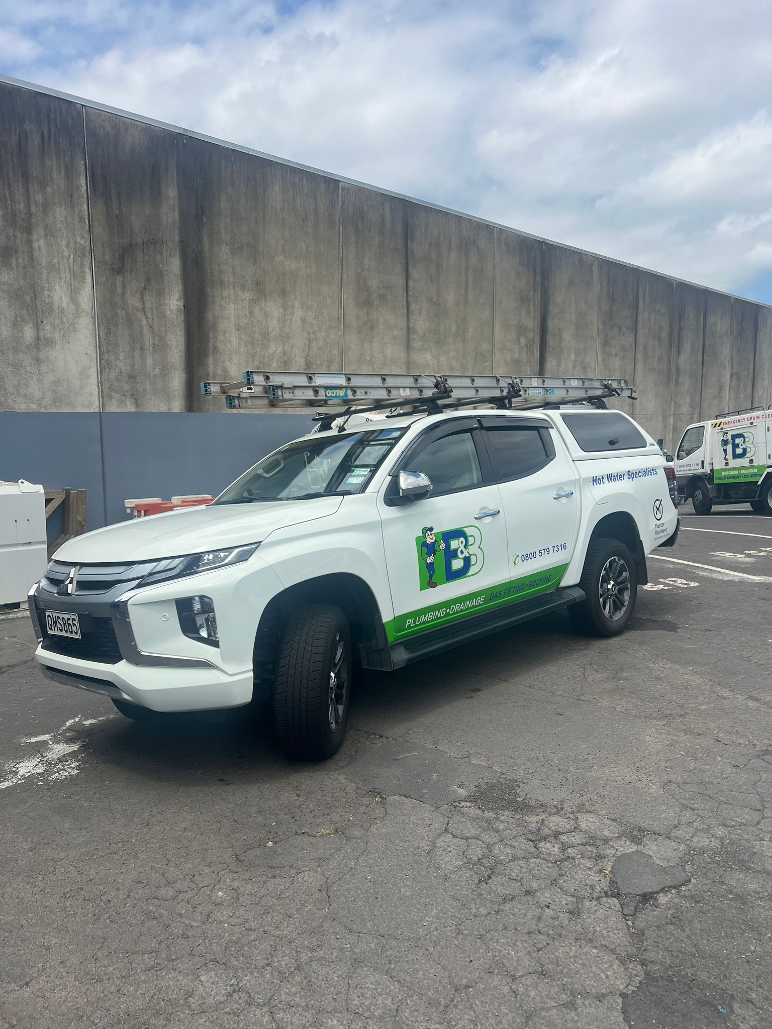 Industrial facility interior with pipes and equipment. Black and white pipes on the floor and ceiling.
