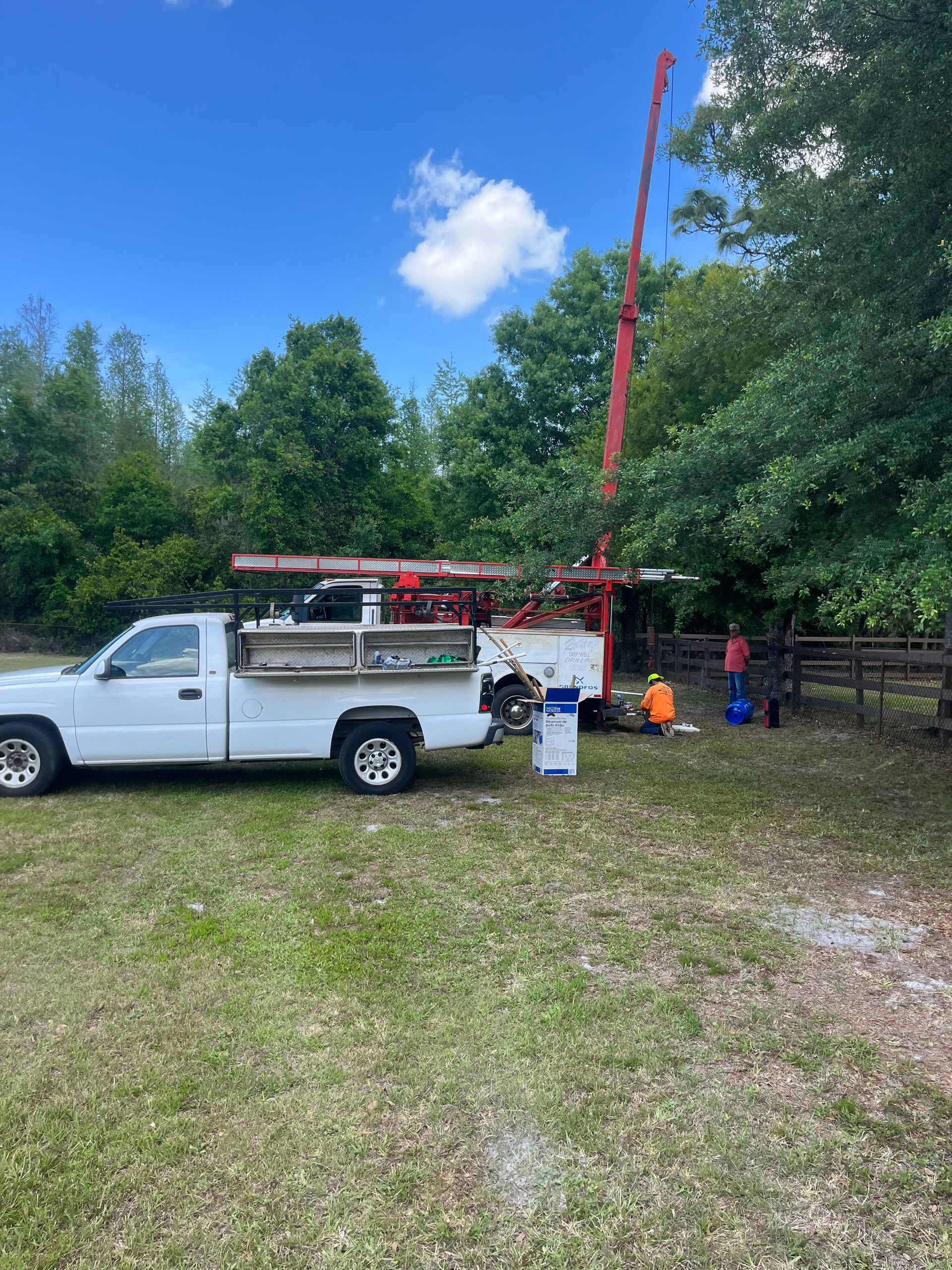 Men drilling a water well