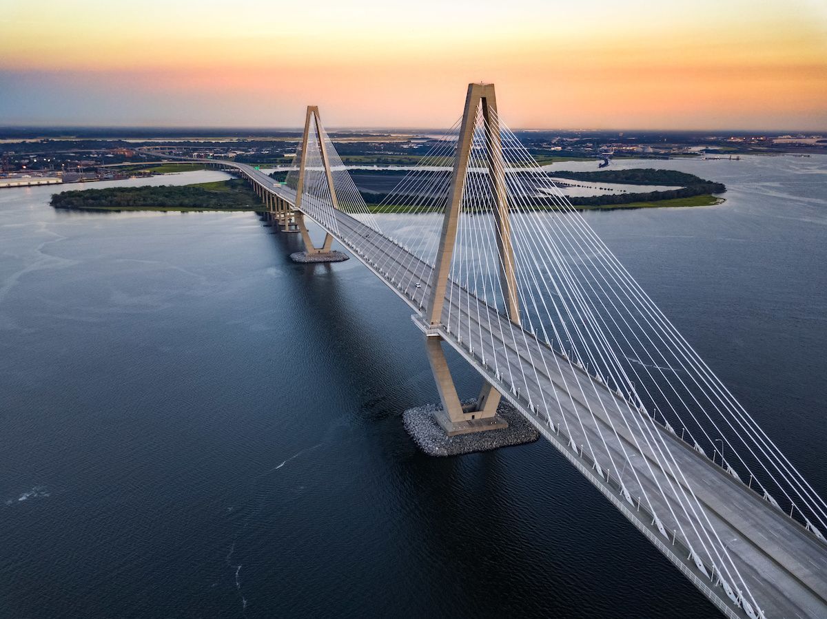 An aerial view of a bridge over a body of water.