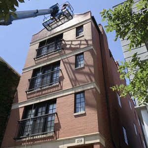 A tall brick building with the number 219 on it