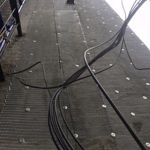 A bunch of wires are laying on the ground