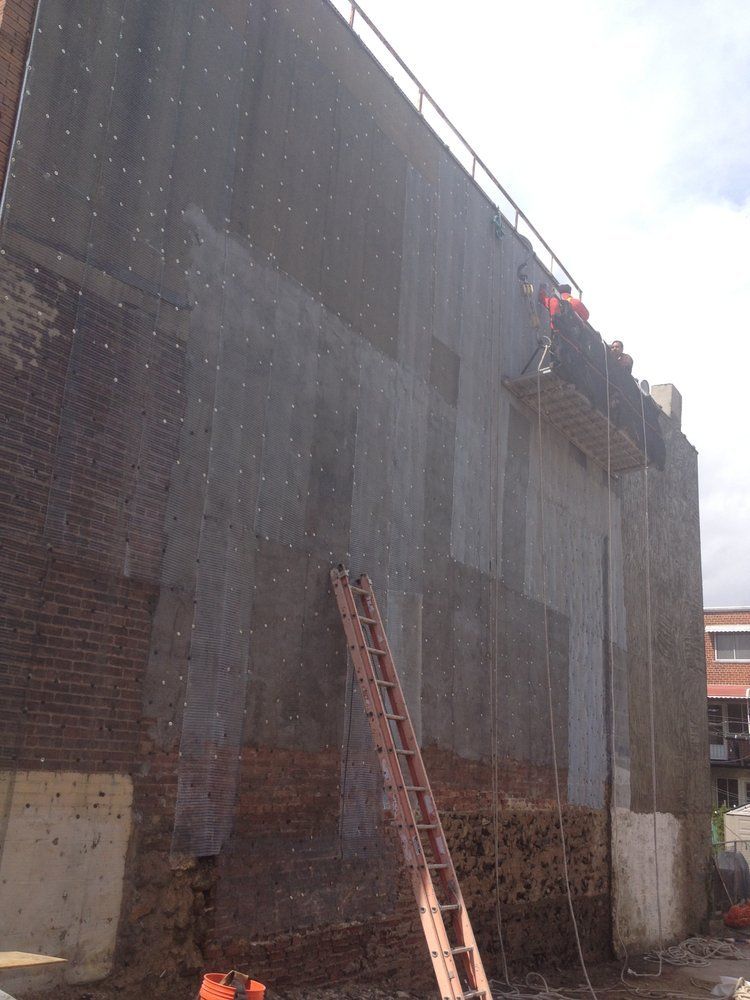 A ladder is leaning against the side of a building