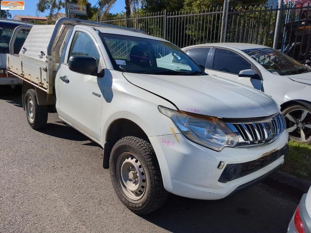 White Mitsubishi Triton Utility Truck — Jap Performance T/A All Tuggerah City Auto Dismantlers in Tuggerah, NSW