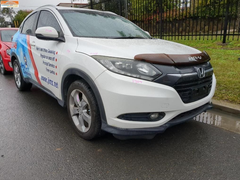 White Honda HR-V Parked on A Wet Road — Jap Performance T/A All Tuggerah City Auto Dismantlers in Bateau Bay, NSW