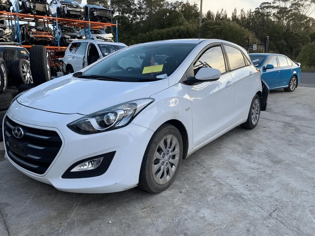White Hyundai I30 Hatchback Car in A Scrap Yard — Jap Performance T/A All Tuggerah City Auto Dismantlers in Newcastle, NSW