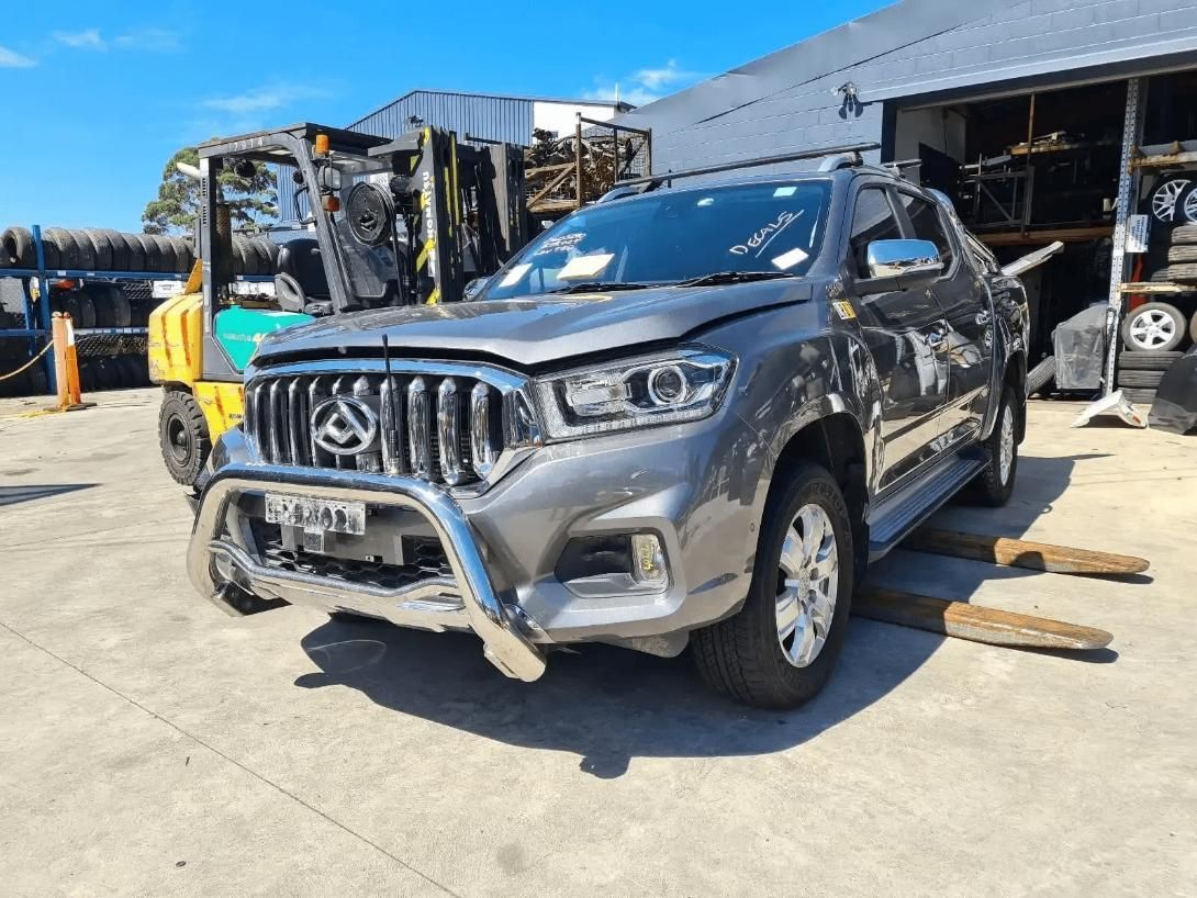 Damaged Gray Pickup Truck on A Loading Dock — Jap Performance T/A All Tuggerah City Auto Dismantlers in Tuggerah, NSW