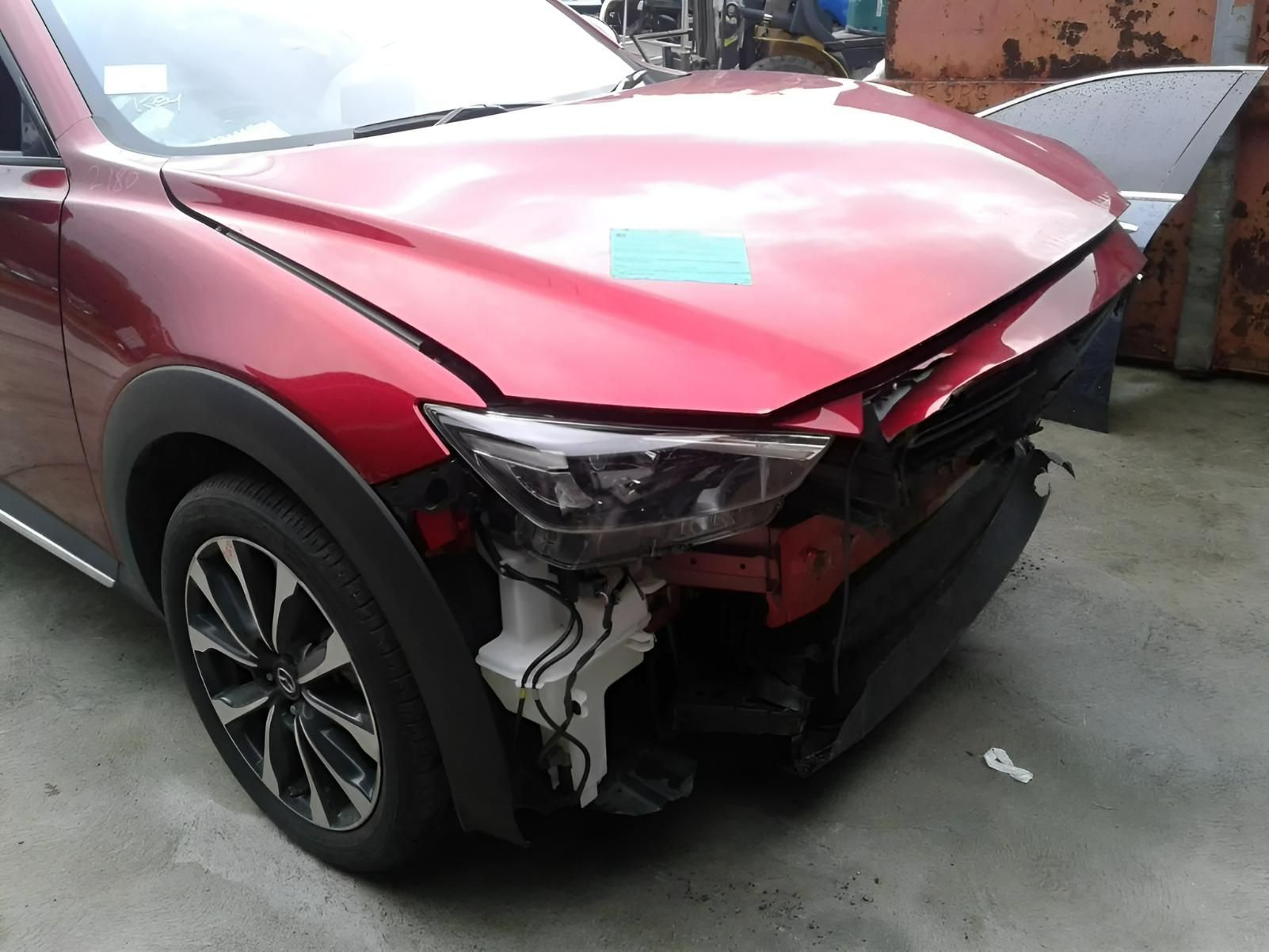 A Damaged Red Car with A Crushed Front End — Jap Performance T/A All Tuggerah City Auto Dismantlers in Tuggerah, NSW