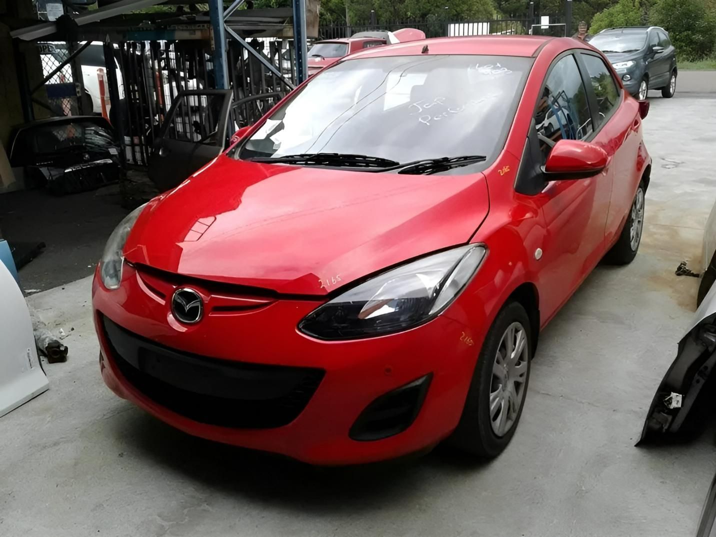 Red Mazda in A Building with Car Parts on The Sides — Jap Performance T/A All Tuggerah City Auto Dismantlers in Morriset, NSW