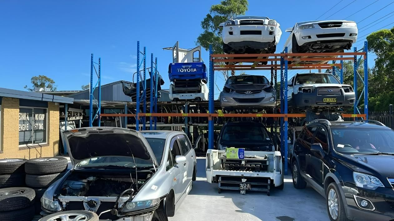 A Scrap Yard with Multiple Vehicles Stacked — Jap Performance T/A All Tuggerah City Auto Dismantlers in Umina Beach, NSW