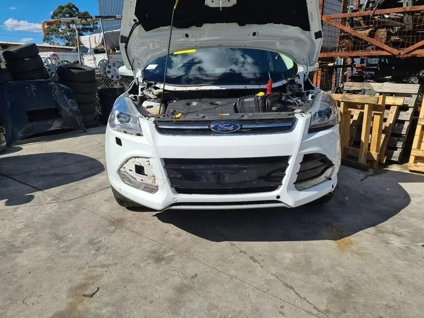 White Ford Suv with Its Hood Open in A Junkyard — Jap Performance T/A All Tuggerah City Auto Dismantlers in Gosford, NSW