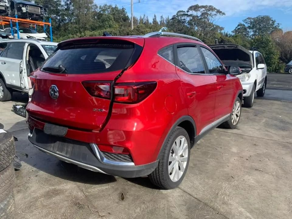 Red MG ZS SUV with Rear-End Damage in A Junkyard — Jap Performance T/A All Tuggerah City Auto Dismantlers in Tuggerah, NSW