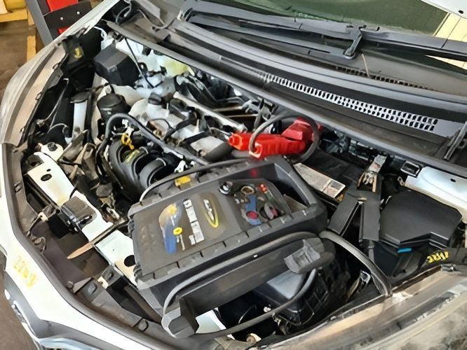 A Car Engine Bay with A Portable Jump Starter — Jap Performance T/A All Tuggerah City Auto Dismantlers in Tuggerah, NSW