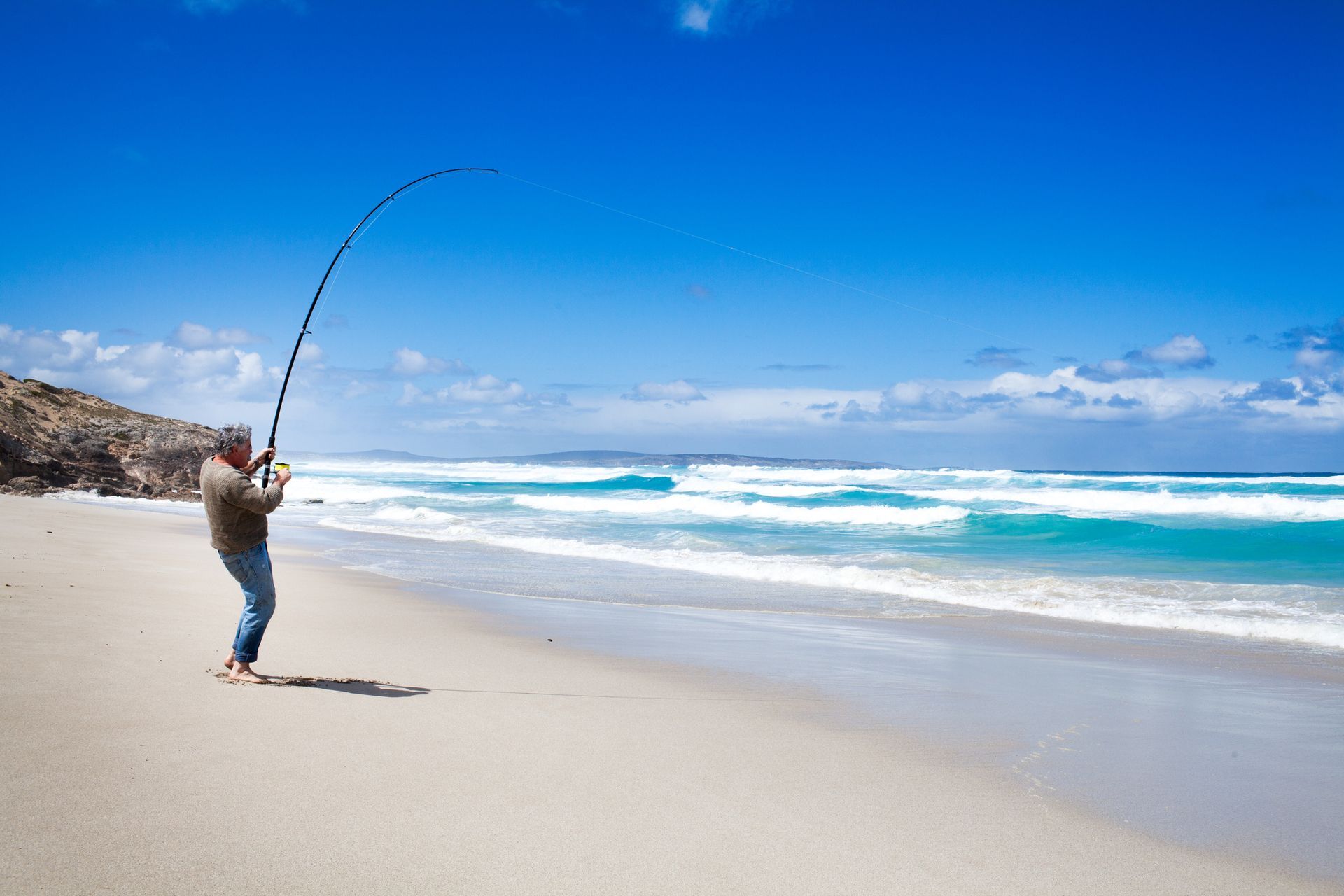 Man Fishing At The Beach Bay — Traralgon, VIC — EB Bookkeeping East