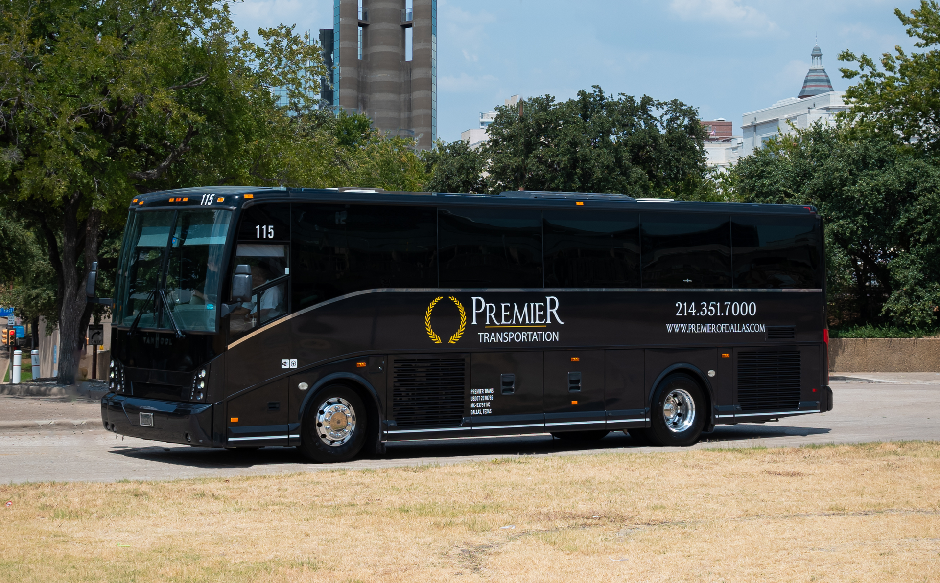 A black bus with the word premier on the side