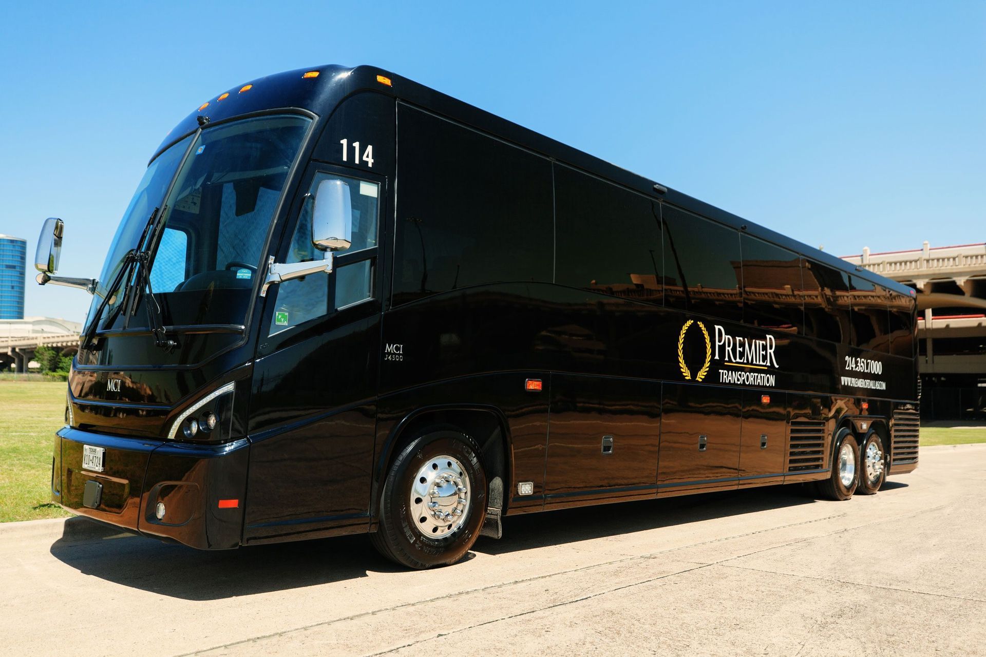 A black bus with the number 113 on it