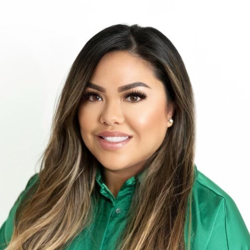A man in a suit and tie is smiling for the camera.