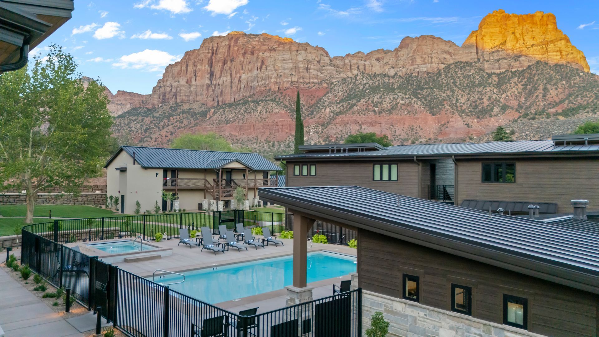 A bottle of hand soap is sitting on a sink next to a brush