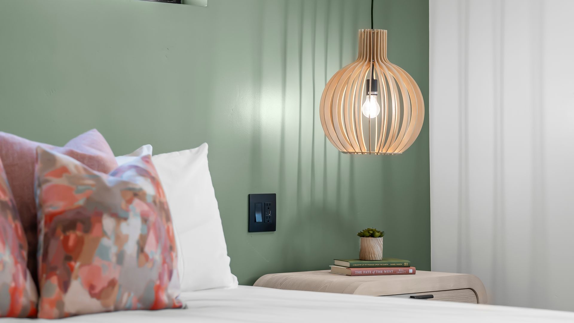 A living room with a couch , chairs , table and a ceiling fan.