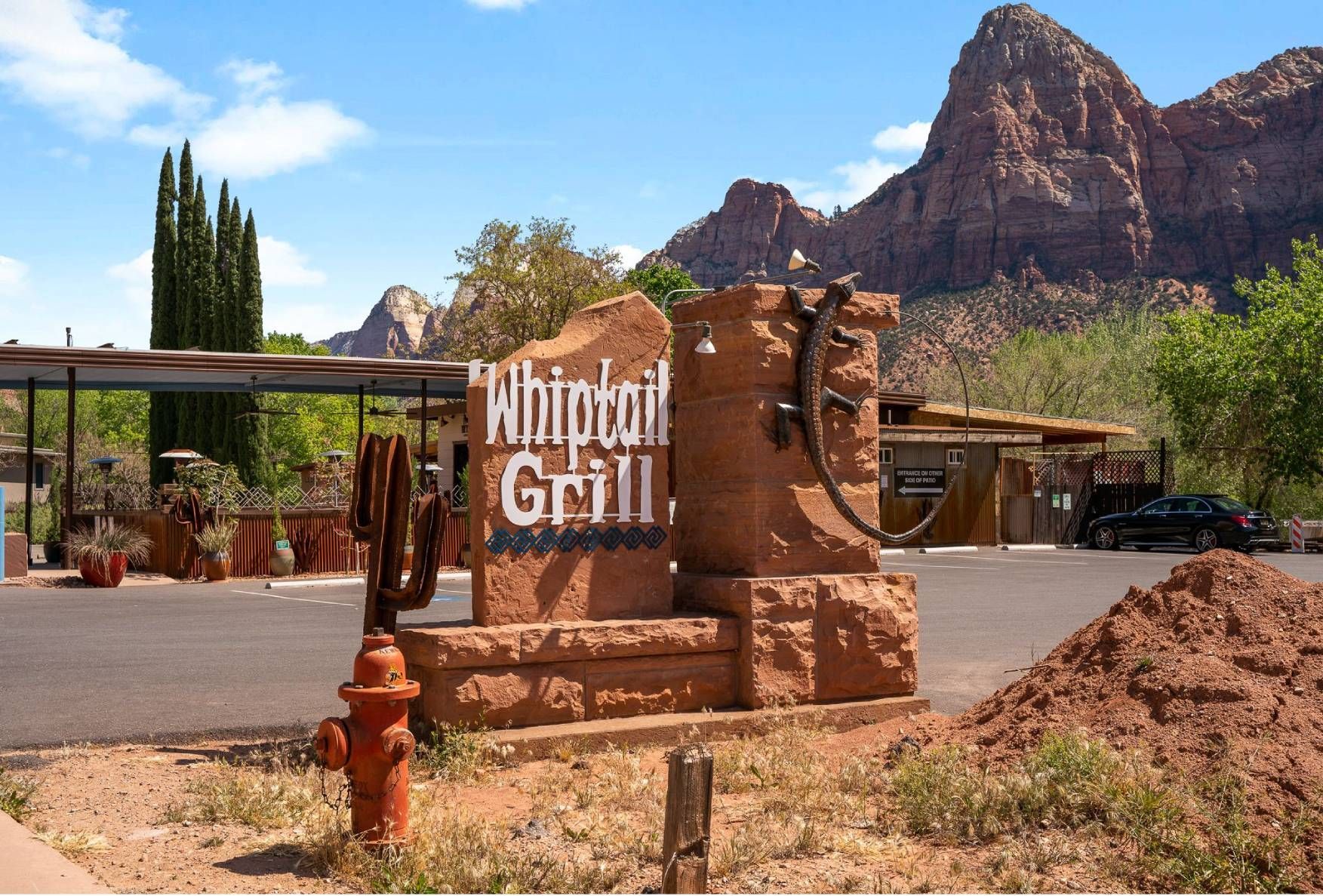 A sign for the whirlpool grill with mountains in the background
