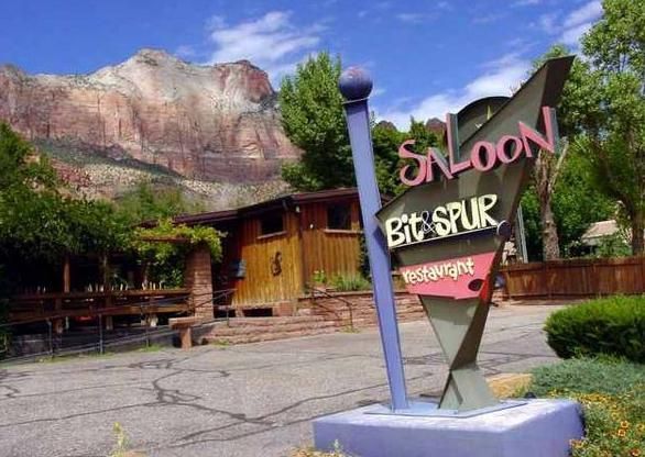 A sign for the saloon bit spur restaurant