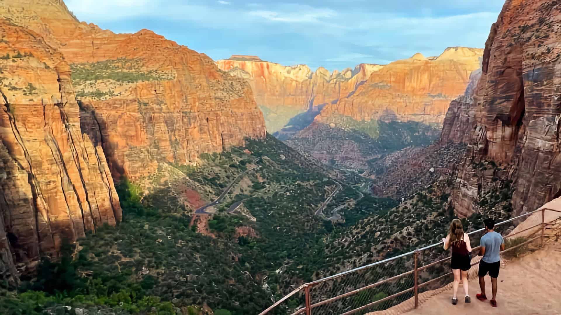 A view of a canyon with mountains in the background.