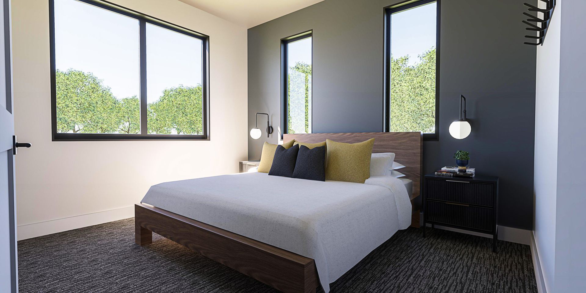 A bedroom with a bed , nightstand , and two windows.