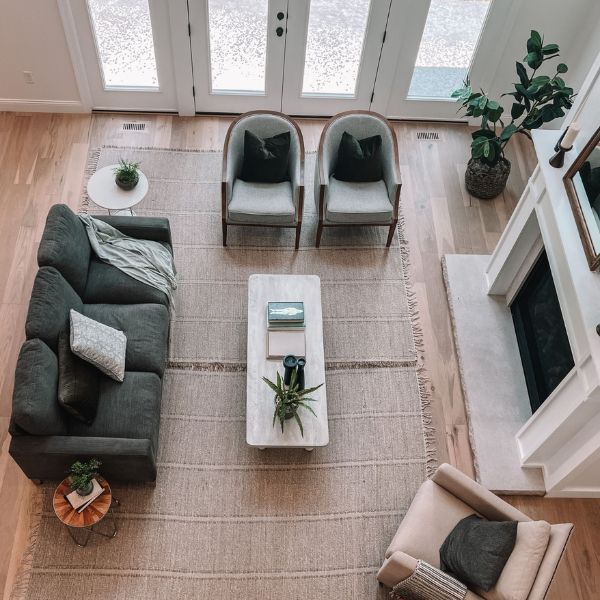 An aerial view of a living room with a couch and chairs