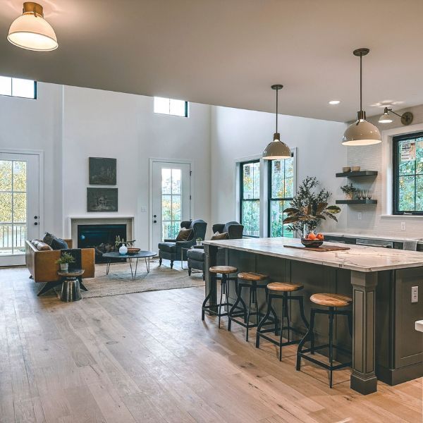 A kitchen with a large island and stools
