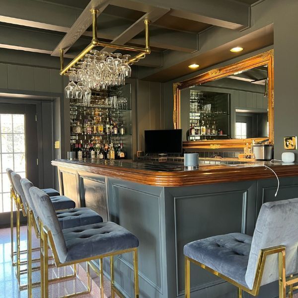 A bar with a lot of wine glasses on it