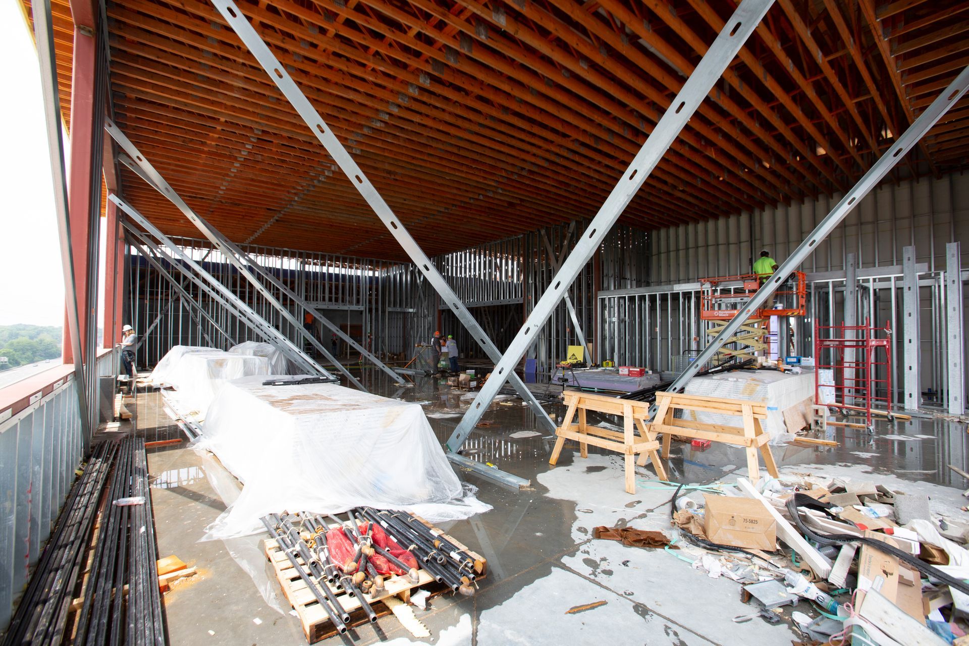 A building under construction with a lot of wooden beams