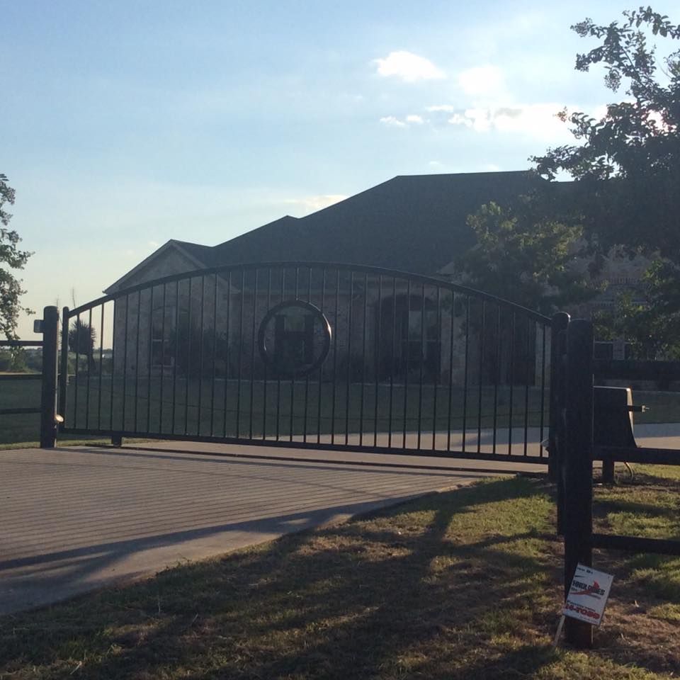 A metal gate with the word ranch on it