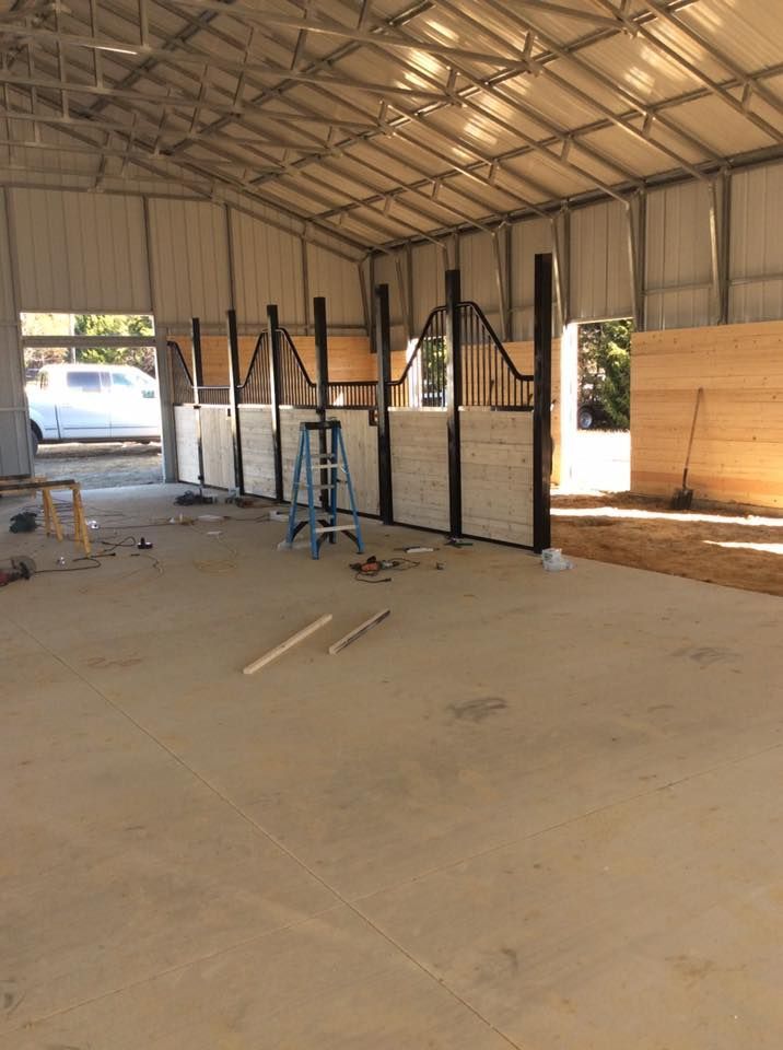 A ladder is sitting in the middle of a building under construction.