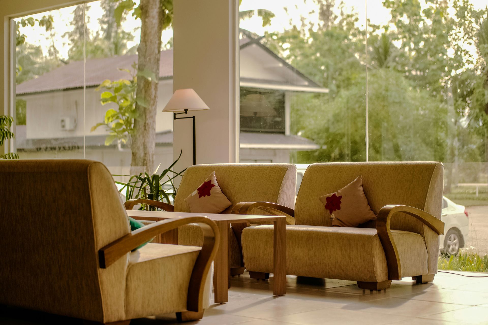 A living room filled with furniture and a large window.