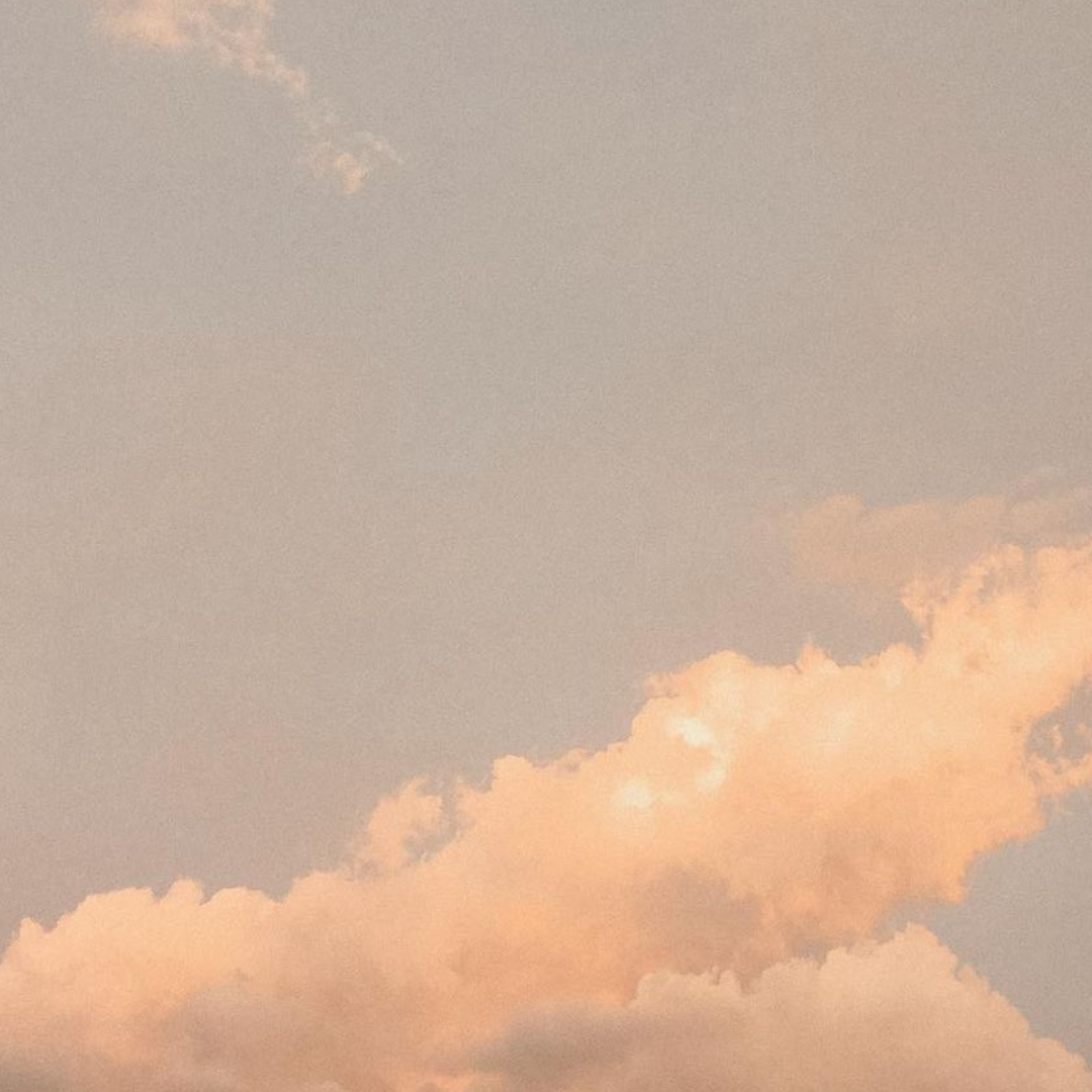 Image of pink muted clouds in the sky.