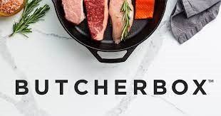 butcher box words in black with meat around it  on a cast iron pan