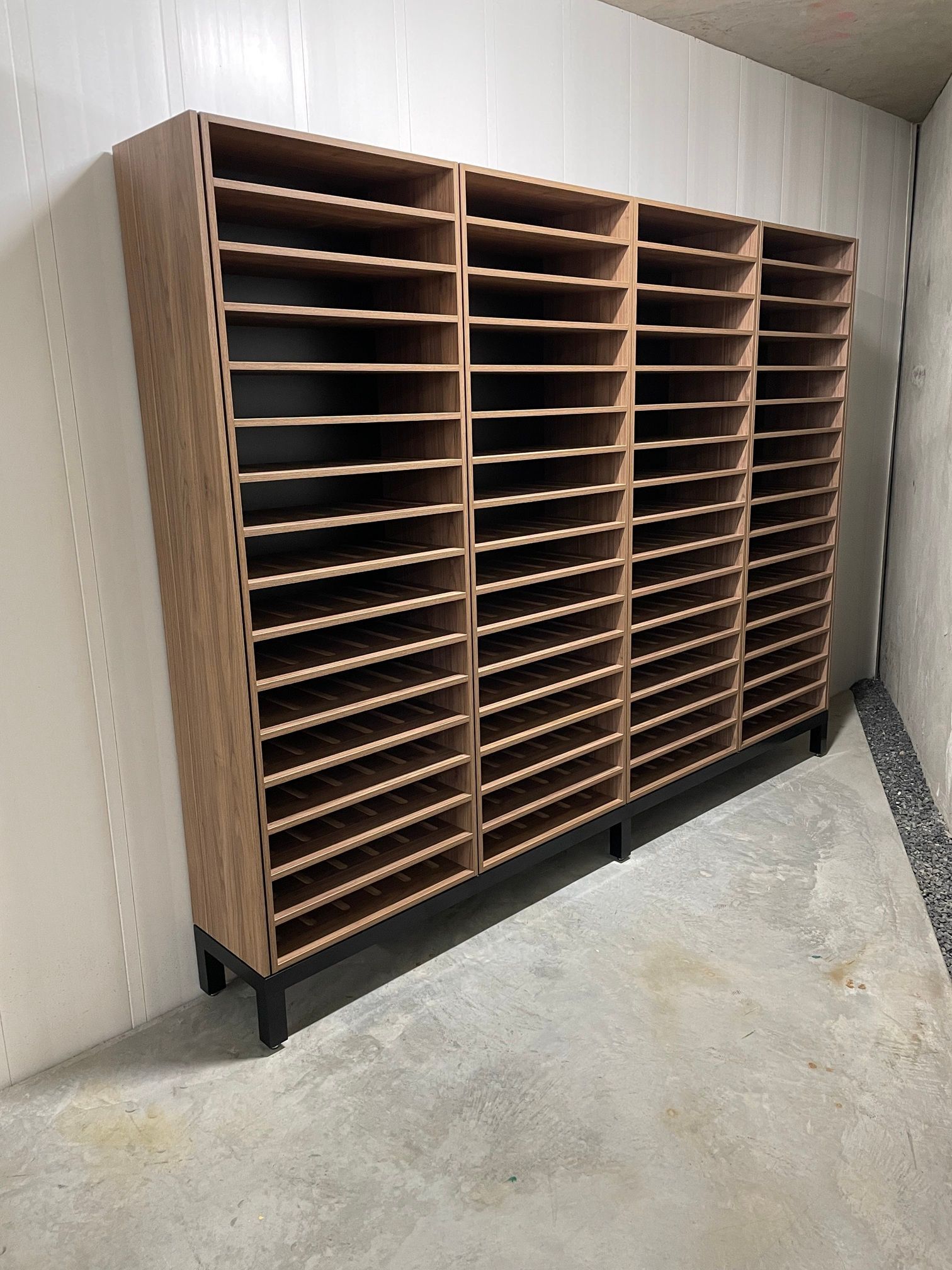 A wooden shelving unit against a wall — Marlix Custom Timber Furniture Design and Joinery in Unanderra, NSW