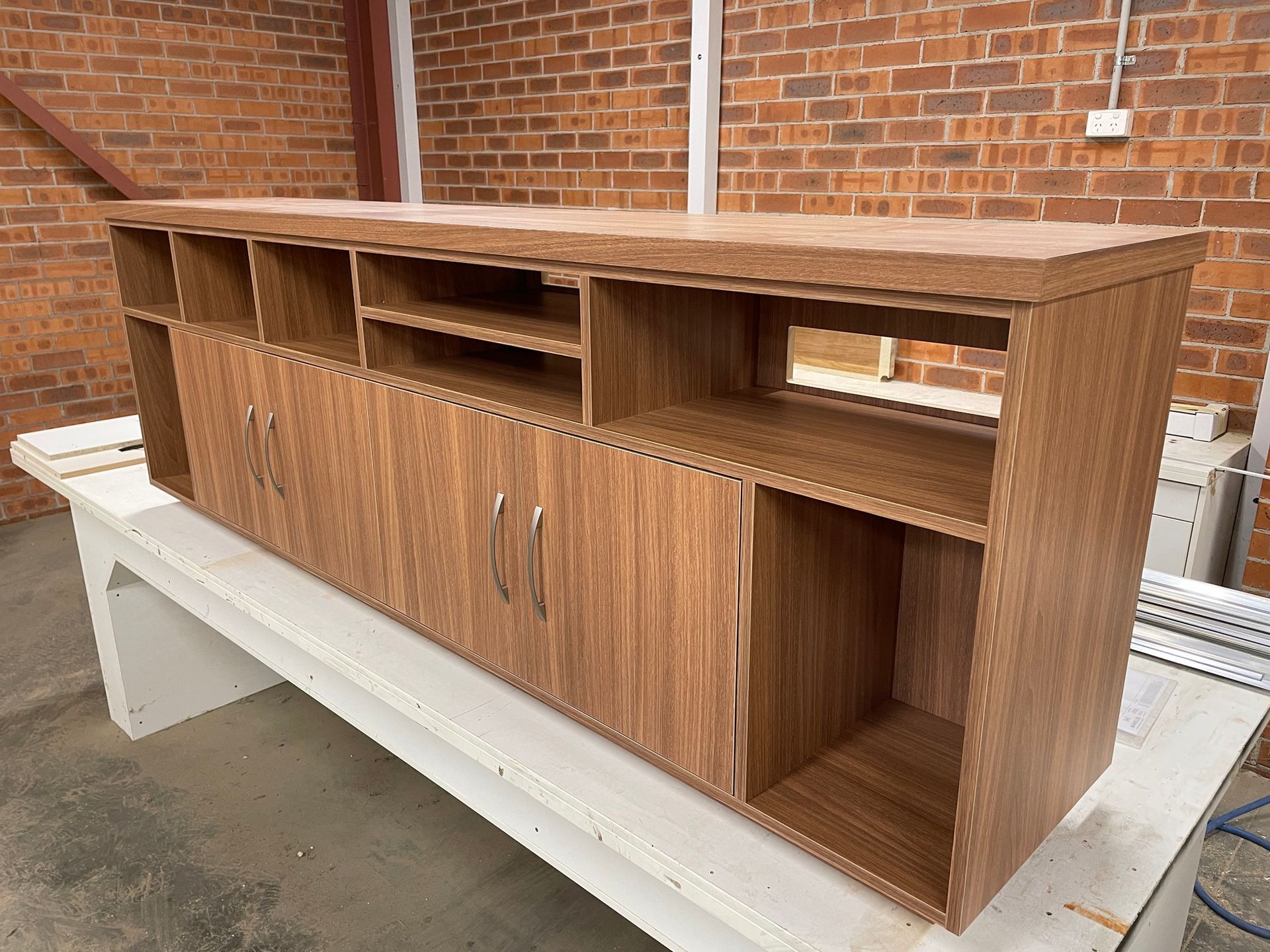 A wooden TV cabinet — Marlix Custom Timber Furniture Design and Joinery in Unanderra, NSW