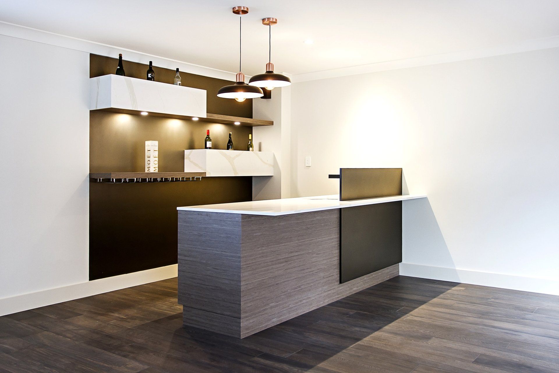 An Empty Room with A Large Counter in The Middle — Marlix Custom Timber Furniture Design and Joinery in Unanderra, NSW