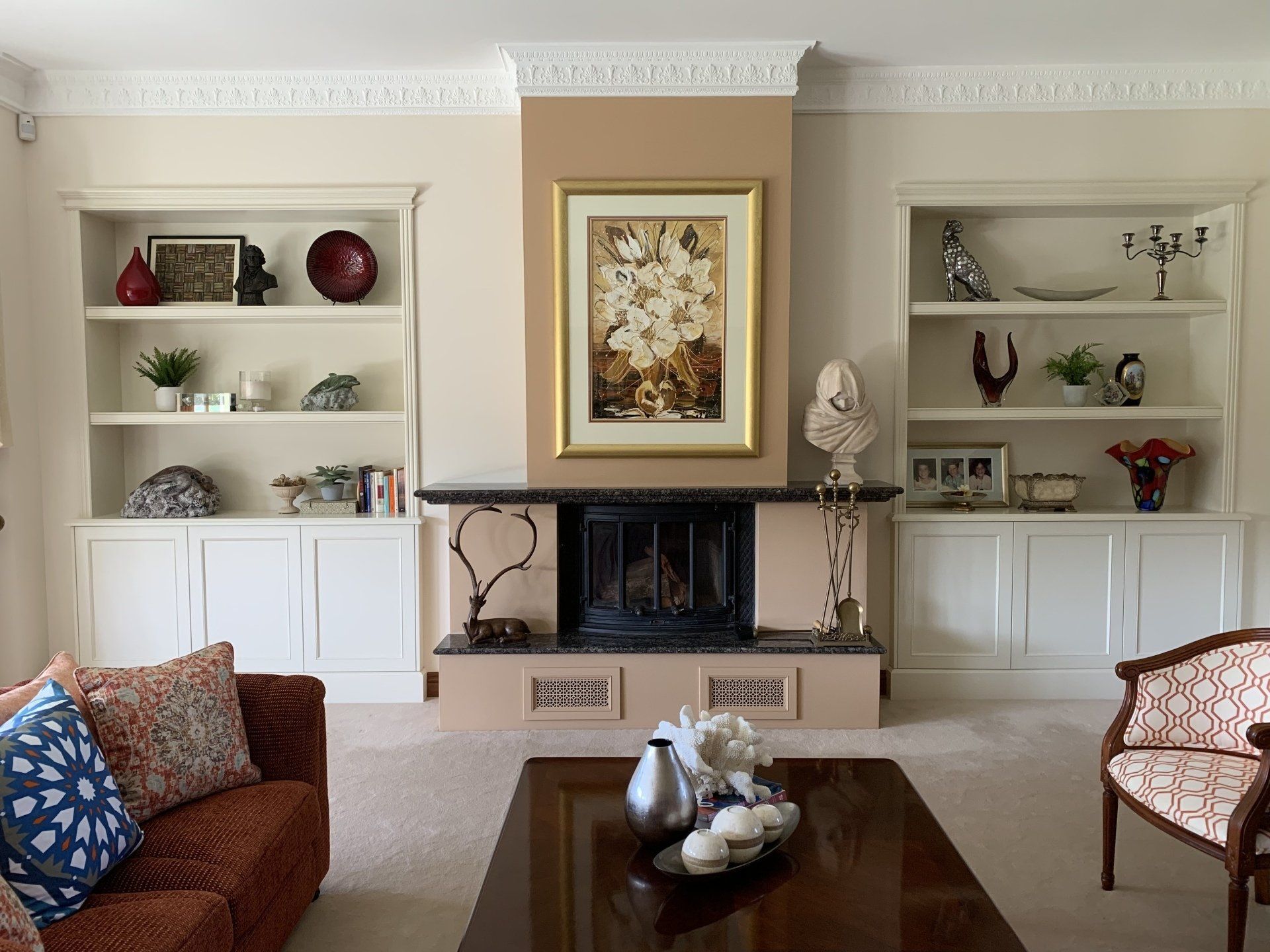 A Living Room with A Fireplace Couch and Chairs — Marlix Custom Timber Furniture Design and Joinery in Unanderra, NSW