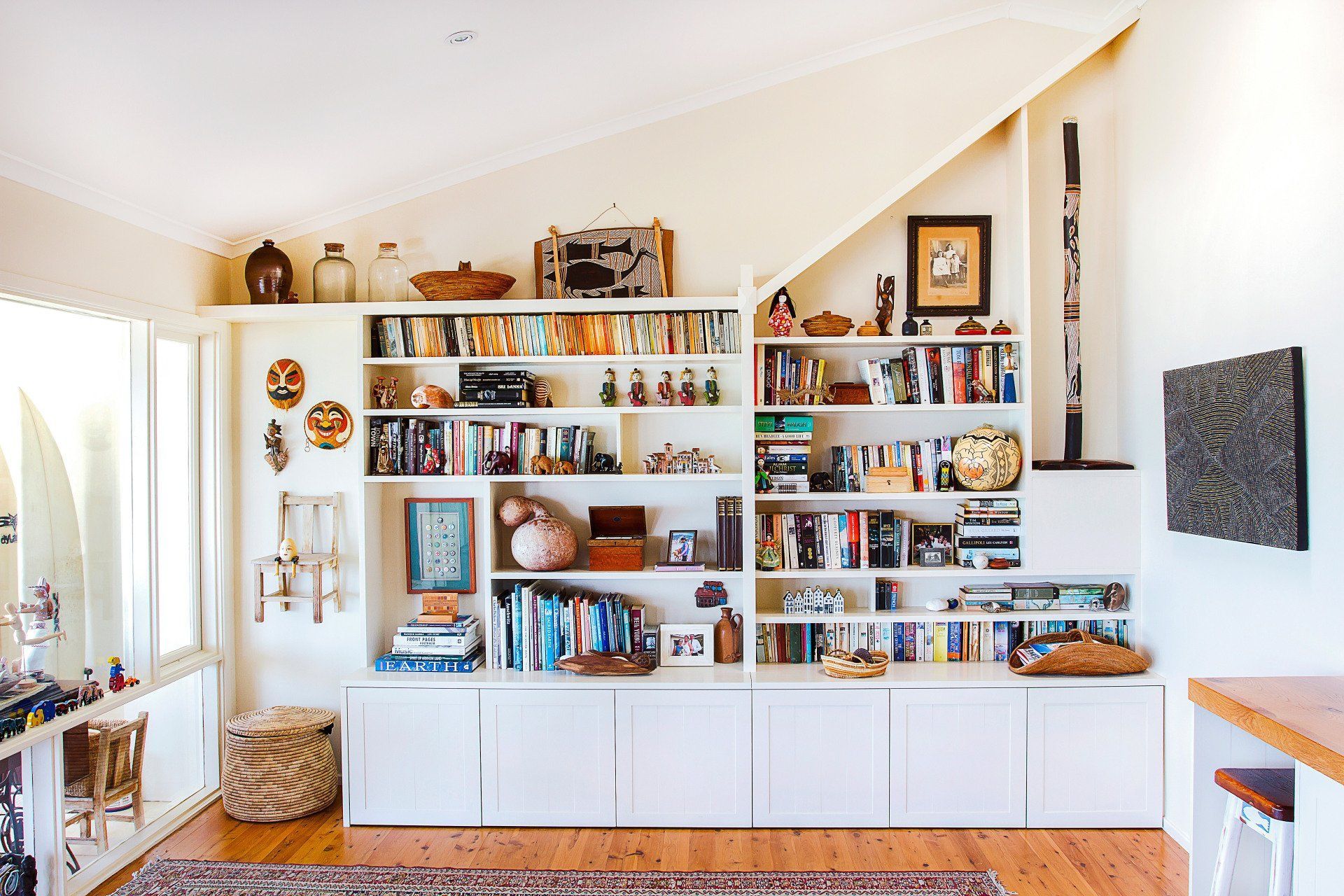 A Living Room with A Couch and A Ceiling Fan — Marlix Custom Timber Furniture Design and Joinery in Unanderra, NSW