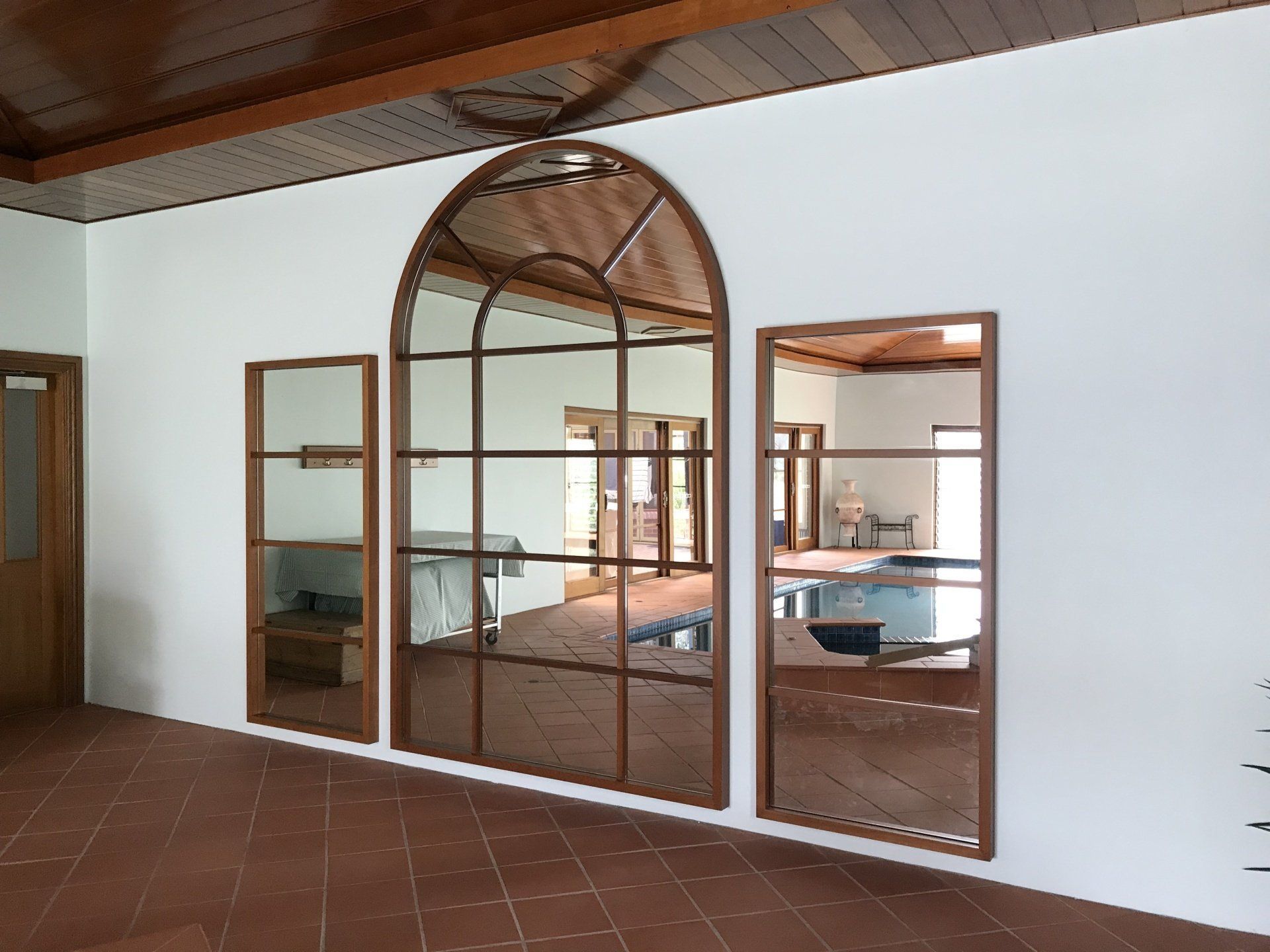 A Room with A Lot of Mirrors on The Wall — Marlix Custom Timber Furniture Design and Joinery in Unanderra, NSW