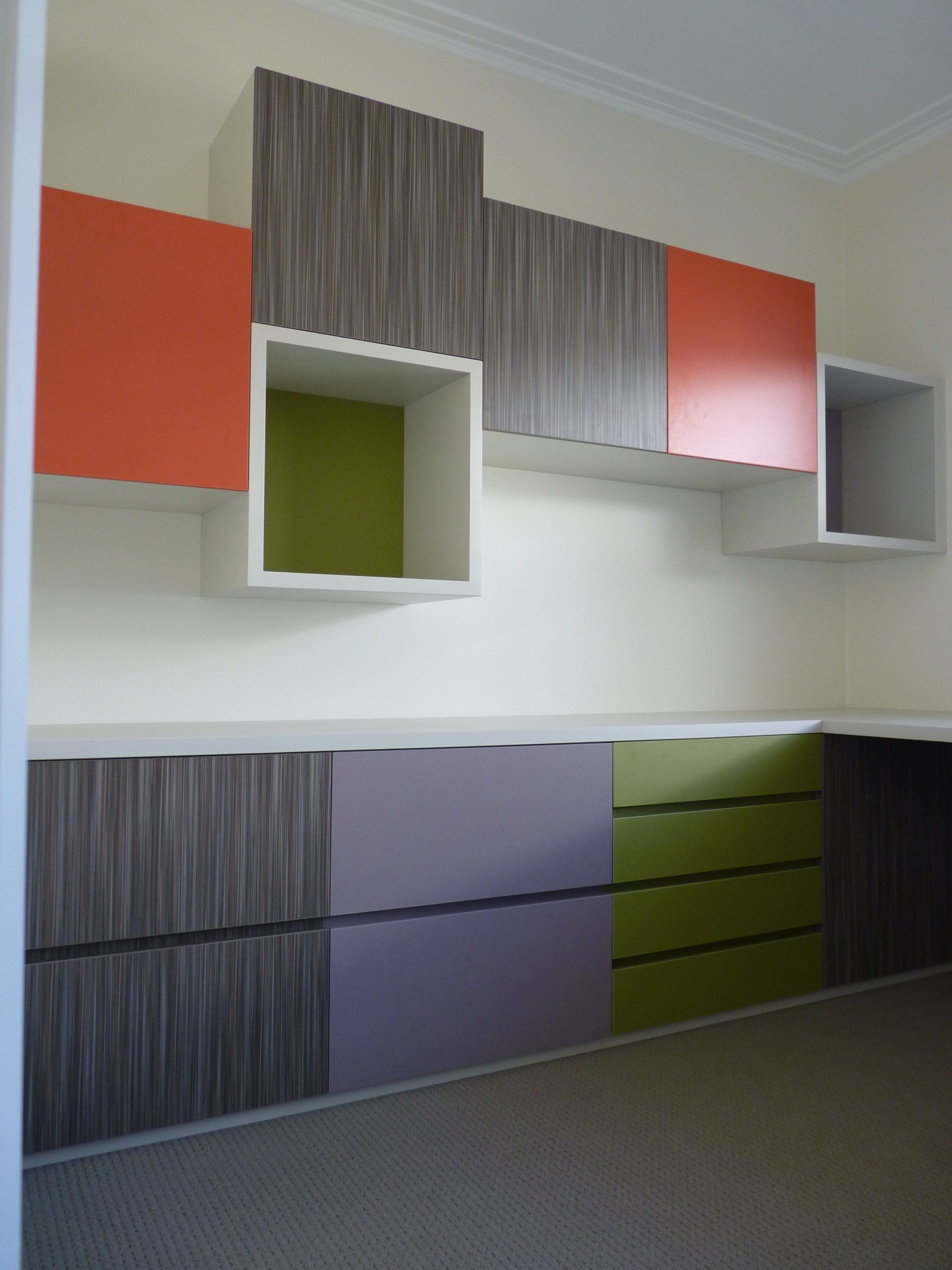 A Room with A Lot of Different Coloured Cabinets and Drawers — Marlix Custom Timber Furniture Design and Joinery in Unanderra, NSW