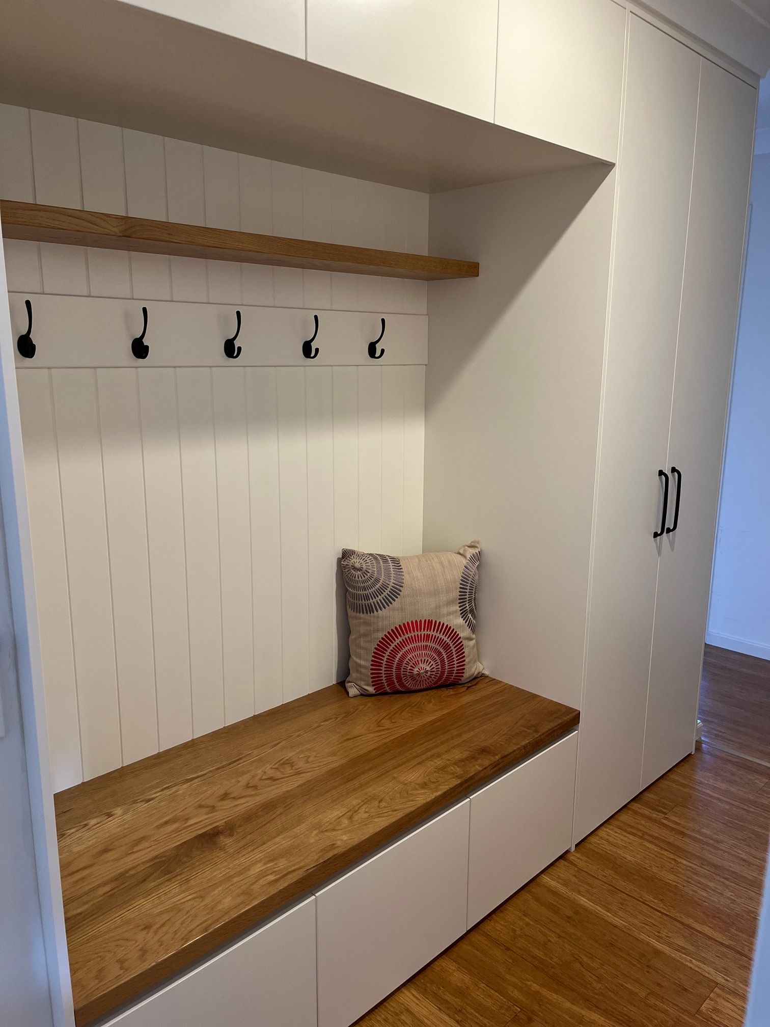 There Is a Bench in The Corner of The Room with A Pillow on It — Marlix Custom Timber Furniture Design and Joinery in Unanderra, NSW