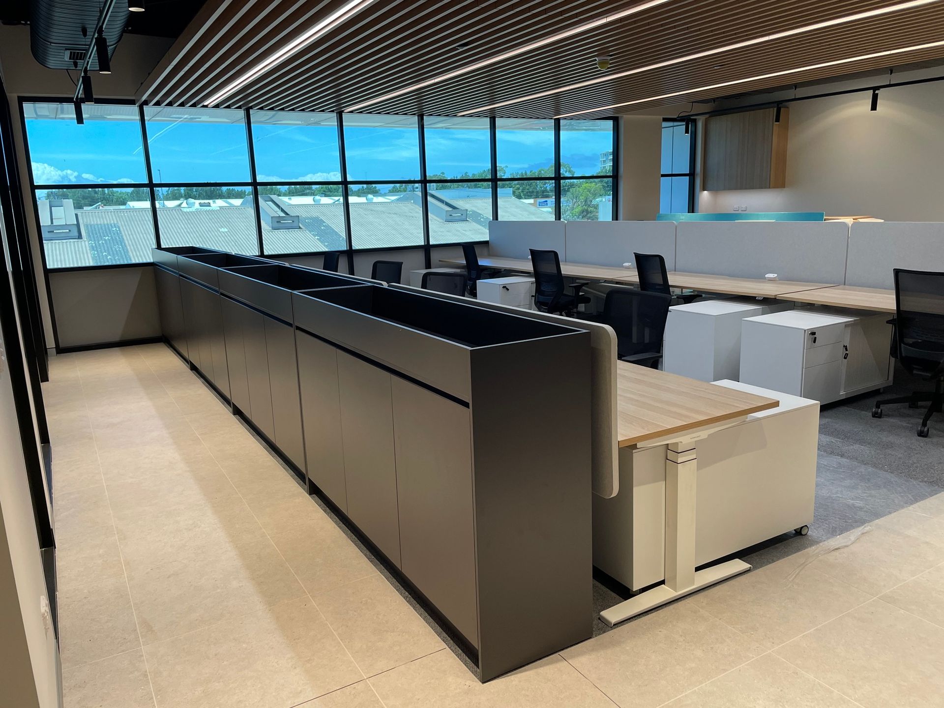 A Large Office with A Lot of Windows and Desks — Marlix Custom Timber Furniture Design and Joinery in Unanderra, NSW
