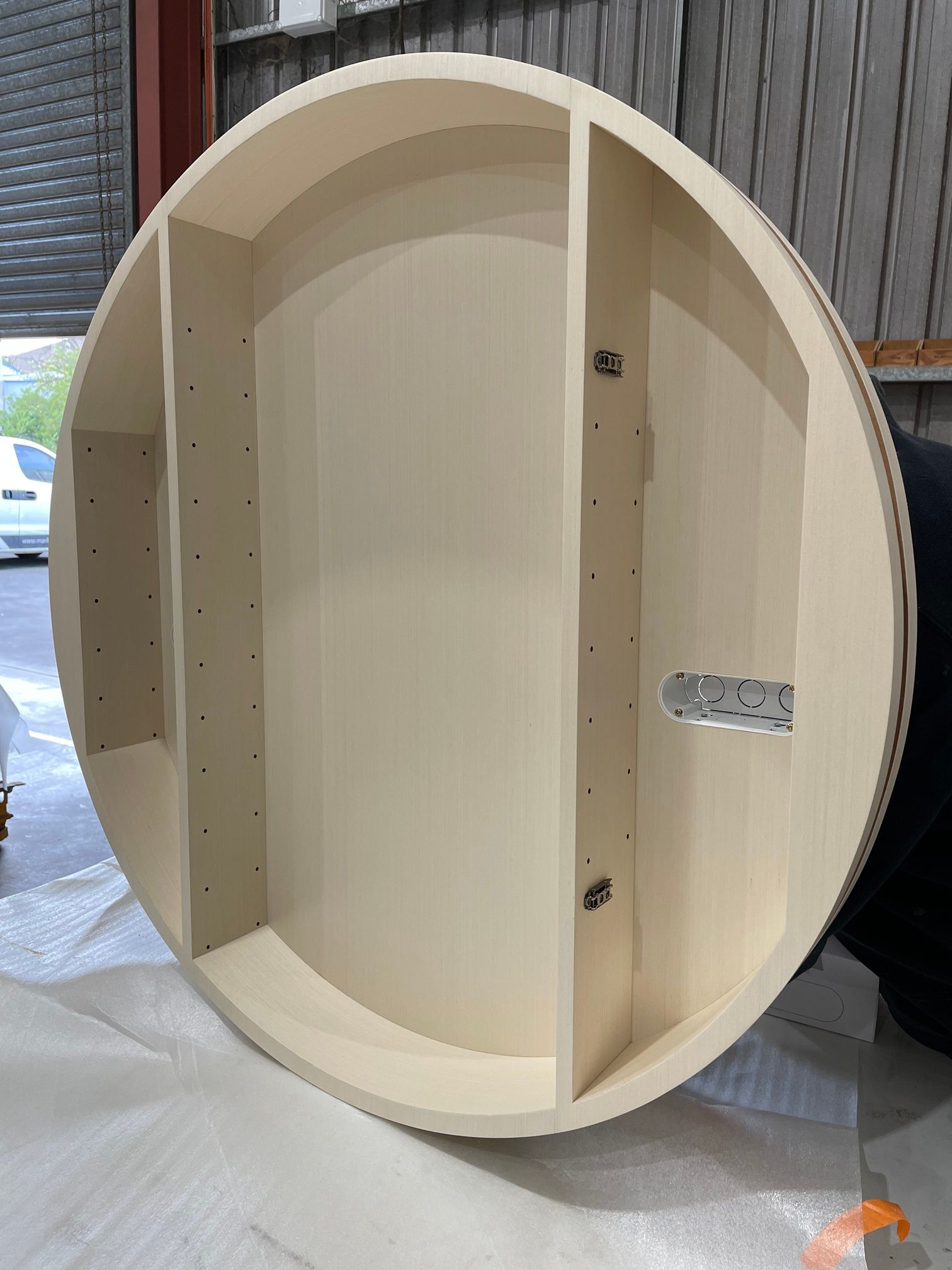 A Large White Round Object Is Sitting on Top of A Table — Marlix Custom Timber Furniture Design and Joinery in Unanderra, NSW